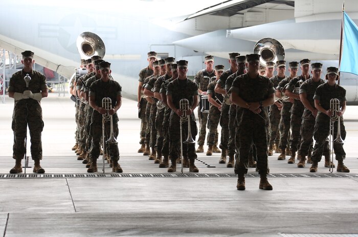 Marines with III Marine Expeditionary Band from Okinawa, Japan, stand in formation before an official change of command ceremony at Marine Corps Air Station Iwakuni, Japan, May 27, 2016. The band performed for Lt. Col. Matthew W. Stover, commanding officer of Marine Aerial Refueler Squadron (VMGR) 152, and Lt. Col. Andrew J. Pushart, special projects officer of Marine Aircraft Group (MAG)12,  during the ceremony. Stover served as commanding officer of VMGR-152 for two year. (U.S. Marine Corps photo by Cpl. Nicole Zurbrugg/Released)