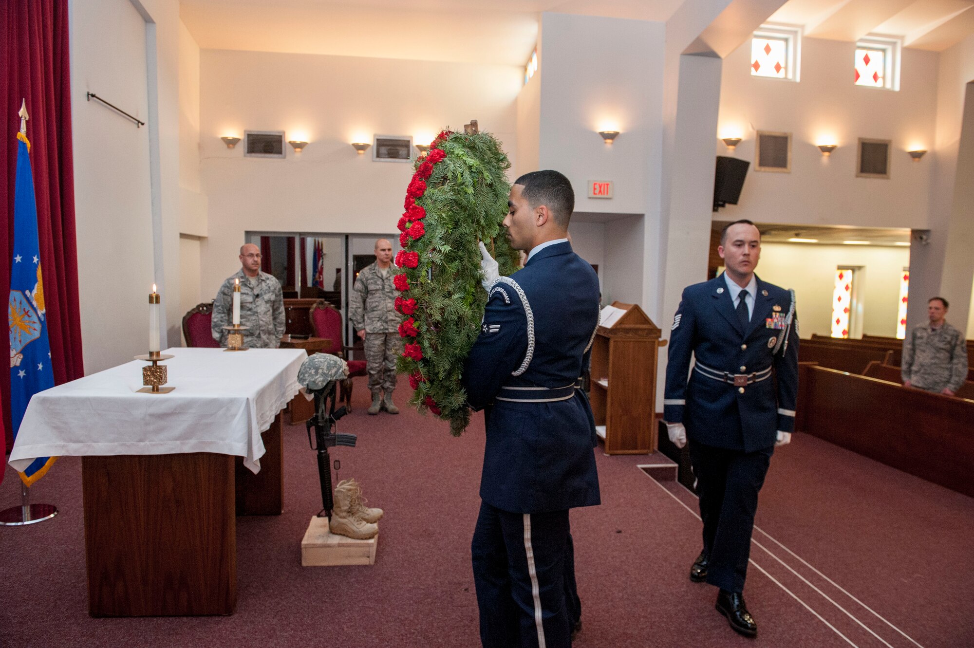Members of the base honor guard place a wreath of flowers during a Memorial Day remembrance ceremony held at the base chapel May 27, 2016, at Incirlik Air Base, Turkey. Memorial Day was originally founded to honor fallen soldiers from the Civil War, now Memorial Day honors all Americans who died in military service.  (U.S. Air Force photo by Staff Sgt. Jack Sanders/Released)