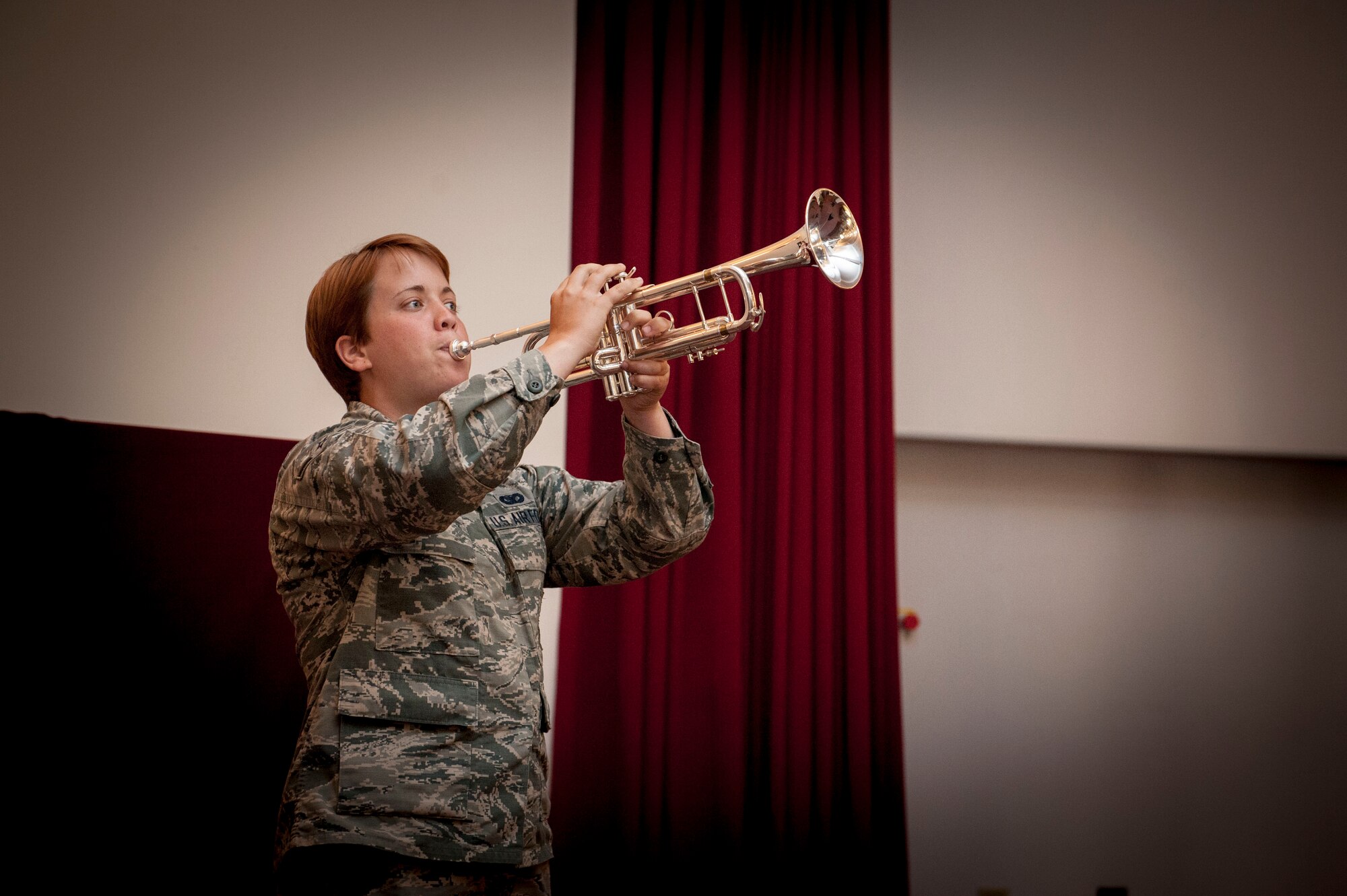 U.S. Air Force Airman Alyssa Flanagan, 39th Security Forces Squadron security response team member, plays “Taps” during a Memorial Day remembrance ceremony at the base chapel May 27, 2016, at Incirlik Air Base, Turkey. “Taps”, traditionally played at military funerals, is a song meant to honor the sacrifice of fallen servicemembers. (U.S. Air Force photo by Staff Sgt. Jack Sanders/Released)