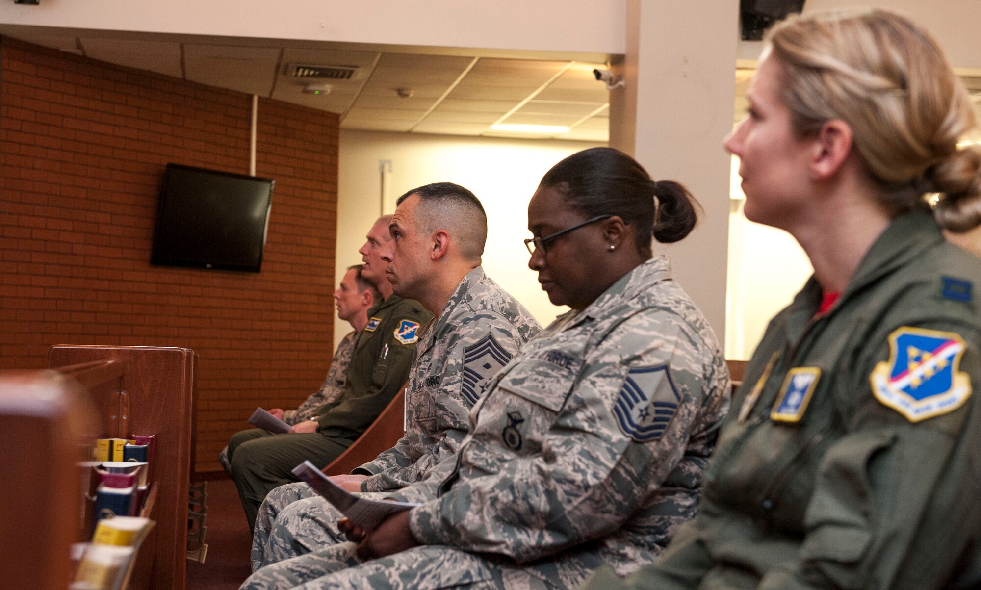 Airmen listen to U.S. Air Force Chaplain (Capt.) David Merrifield, 39th Air Base Wing, speak during a Memorial Day remembrance ceremony at the base chapel May 27, 2016, at Incirlik Air Base, Turkey. Merrifield spoke on remembering we stand on the shoulders of those who came before us and paid the ultimate price. (U.S. Air Force photo by Staff Sgt. Jack Sanders/Released)