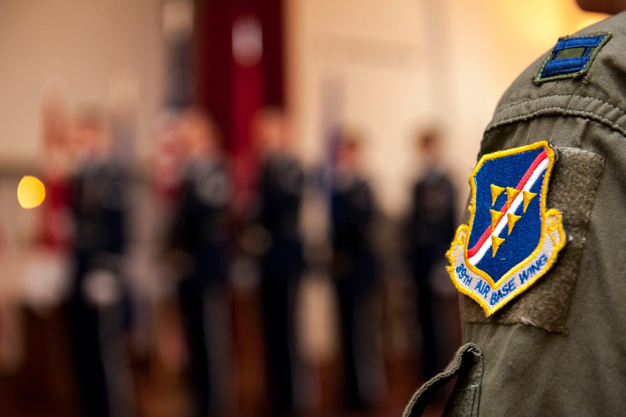 U.S. Air Force Capt. Sean Perry, 39th Air Base Wing executive officer, watches as the base honor guard presents the colors before the playing of the Turkish and U.S. National anthems during a Memorial Day remembrance ceremony held at the base chapel May 27, 2016, at Incirlik Air Base, Turkey. The remembrance ceremony was a time to reflect on those lost during past and current conflicts. (U.S. Air Force photo by Staff Sgt. Jack Sanders/Released)