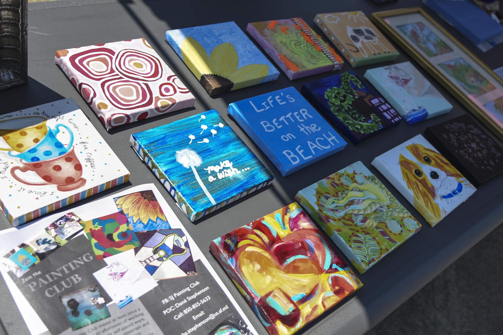Art is displayed from the Paint Club during a Make It Better Club Day event, May 26, 2016, at Seymour Johnson Air Force Base, North Carolina. More than 60 clubs were present to speak about their hobby and reach out to Airmen and their families. (U.S. Air Force photo by Airman Shawna L. Keyes/Released)    