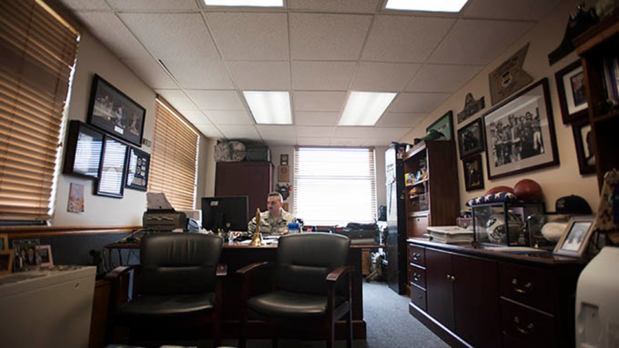 Senior Master Sgt. Victor Dempsey, 514th Security Forces Squadron superintendent, sits in his office May 18, 2016 at Joint Base McGuire-Dix-Lakehurst, N.J. Dempsey has been an Air Force Reserve security forces member for thirty years and served simultaneously as a New York City police officer for twenty years. (U.S. Air Force photo by Staff Sgt. Katherine Tereyama)