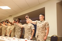 NAVAL SUPPORT FACILITY INDIAN HEAD, Md. – Corporals with Chemical Biological Incident Response Force (CBIRF), U.S. Marine Corps Forces Command (MARFORCOM), graduate from command sponsored Corporals Leadership Course during a ceremony at Naval Support Facility Indian Head, Md., May 27, 2016. The night before, the Marines tested their refined customs and courtesies during a Mess Night with Gunnery Sgt. Amber T. Chavarria, faculty advisor at Staff Noncommissioned Officer Academy, Marine Corps Base Quantico, Va., as the event’s guest of honor. The noncommissioned officers completed the 3 week course curriculum that included sword and guidon manual, land navigation, Marine Corps promotion system for sergeants and below and other small unit leader skills and traits. (Official USMC Photos by Sgt. Santiago G. Colon Jr. and Sgt. Jonathan S. Herrera)