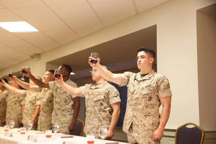 NAVAL SUPPORT FACILITY INDIAN HEAD, Md. – Corporals with Chemical Biological Incident Response Force (CBIRF), U.S. Marine Corps Forces Command (MARFORCOM), graduate from command sponsored Corporals Leadership Course during a ceremony at Naval Support Facility Indian Head, Md., May 27, 2016. The night before, the Marines tested their refined customs and courtesies during a Mess Night with Gunnery Sgt. Amber T. Chavarria, faculty advisor at Staff Noncommissioned Officer Academy, Marine Corps Base Quantico, Va., as the event’s guest of honor. The noncommissioned officers completed the 3 week course curriculum that included sword and guidon manual, land navigation, Marine Corps promotion system for sergeants and below and other small unit leader skills and traits. (Official USMC Photos by Sgt. Santiago G. Colon Jr. and Sgt. Jonathan S. Herrera)
