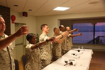 NAVAL SUPPORT FACILITY INDIAN HEAD, Md. – Corporals with Chemical Biological Incident Response Force (CBIRF), U.S. Marine Corps Forces Command (MARFORCOM), graduate from command sponsored Corporals Leadership Course during a ceremony at Naval Support Facility Indian Head, Md., May 27, 2016. The night before, the Marines tested their refined customs and courtesies during a Mess Night with Gunnery Sgt. Amber T. Chavarria, faculty advisor at Staff Noncommissioned Officer Academy, Marine Corps Base Quantico, Va., as the event’s guest of honor. The noncommissioned officers completed the 3 week course curriculum that included sword and guidon manual, land navigation, Marine Corps promotion system for sergeants and below and other small unit leader skills and traits. (Official USMC Photos by Sgt. Santiago G. Colon Jr. and Sgt. Jonathan S. Herrera)