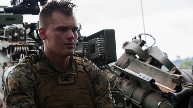 Cpl. John Fox, a field artillery cannoneer with Alpha Battery, 1st Battalion, 12th Marine Regiment, “Kings of Battle,” and a Hedgesville, W. Va., native, sits by his M777 Lightweight 155mm howitzer during Spartan Fury, an annual pre-deployment exercise, aboard the Schofield Range Facility on May 4th, 2016.  Spartan Fury is one of three annual battalion level exercises to help improve sustainment training for future deployments. The objective of this five-day exercise is to support 3rd Regiment by providing direct and indirect artillery strikes. 