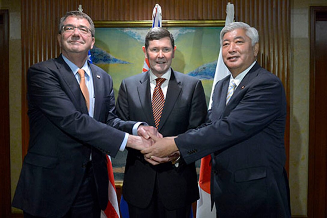 Defense Secretary Ash Carter, left, poses with Australian Defense Minister Kevin Andrews, center, and Japanese Defense Minister Gen Nakatani, right, shortly before the Shangri-La Dialogue in Singapore, May 30, 2015. DOD Photo by Glenn Fawcett