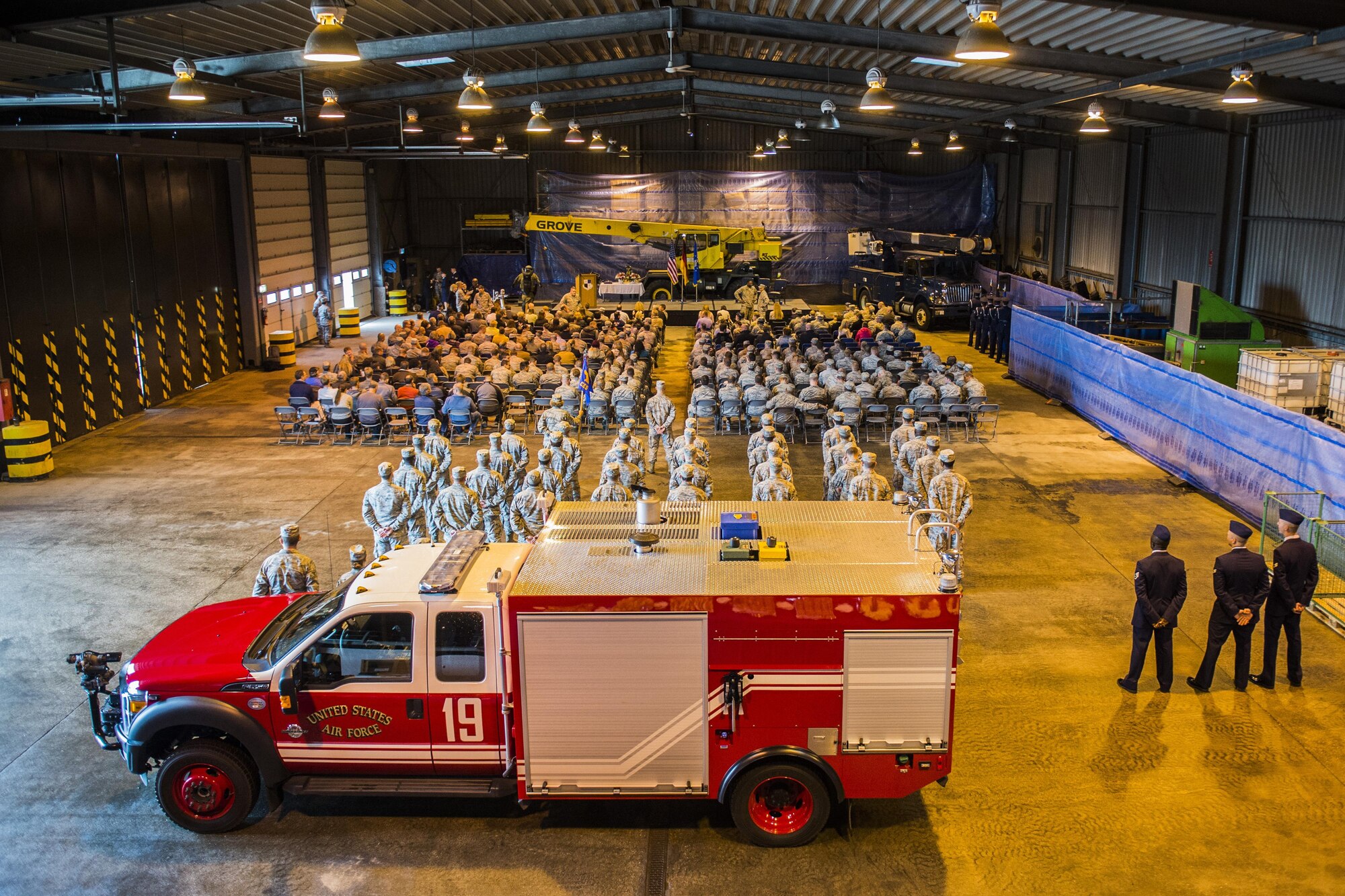 Airmen and community members wait the arrival of the official party before the start of the 52nd Civil Engineer Squadron change of command ceremony at Spangdahlem Air Base, Germany, June 1, 2016. More than 200 Airmen and community members attended the ceremony in which U.S. Air Force Lt. Col. Christopher Meeker, former 52nd CES commander, relinquished command to U.S. Air Force Lt. Col. Ryan Crowley, incoming 52nd CES commander. (U.S. Air Force photo by Senior Airman Luke Kitterman/Released)