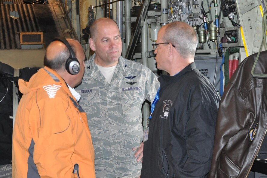 Col. James Dignan (center), 910th Airlift Wing commander, speaks with City of Youngstown, Ohio Finance Director David Bozanich and Ohio State District 64 Representative Michael O’Brien on the cargo deck of a C-130H Hercules tactical cargo aircraft assigned to the 910th Airlift Wing based at Youngstown Air Reserve Station (YARS), Ohio, during a flight to Naval Air Station Key West, Florida, April 28, 2016. Boazanich and O’Brien were two of 35 Mahoning Valley civic leaders participating in the 910th Airlift Wing’s 2016 Civic Leader Tour, held April 28-29, 2016. The group of civic leaders and their military escorts attended the two-day, one-night event, designed to give them a better understanding of Air Force Reserve and Joint Operation missions and how they differ from base to base around the country. (U.S. Air Force photo/Master Sgt. Bob Barko Jr.)