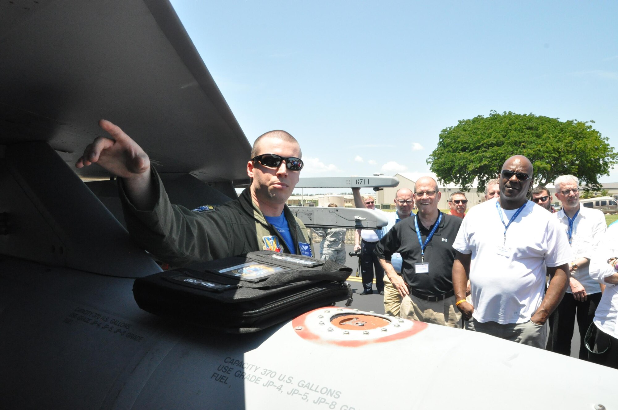 Capt. Nick “Ripper” Lockhart (right), an F-16 pilot assigned to the 93rd Fighter Squadron, points out a feature on an F-16 Fighting Falcon fighter aircraft to a group of civic leaders on the flightline here, April 29, 2016. A walk around of the F-16 and the opportunity to talk with Lockhart was part of the itinerary of the 910th Airlift Wing’s 2016 Civic Leader Tour originating from Youngstown Air Reserve Station, Ohio. A group of 35 civic leaders and their military escorts attended the two-day event, designed to give them a better understanding of Air Force Reserve and Joint Operation missions and how they differ from base to base around the country. (U.S. Air Force photo/Master Sgt. Bob Barko Jr.)
