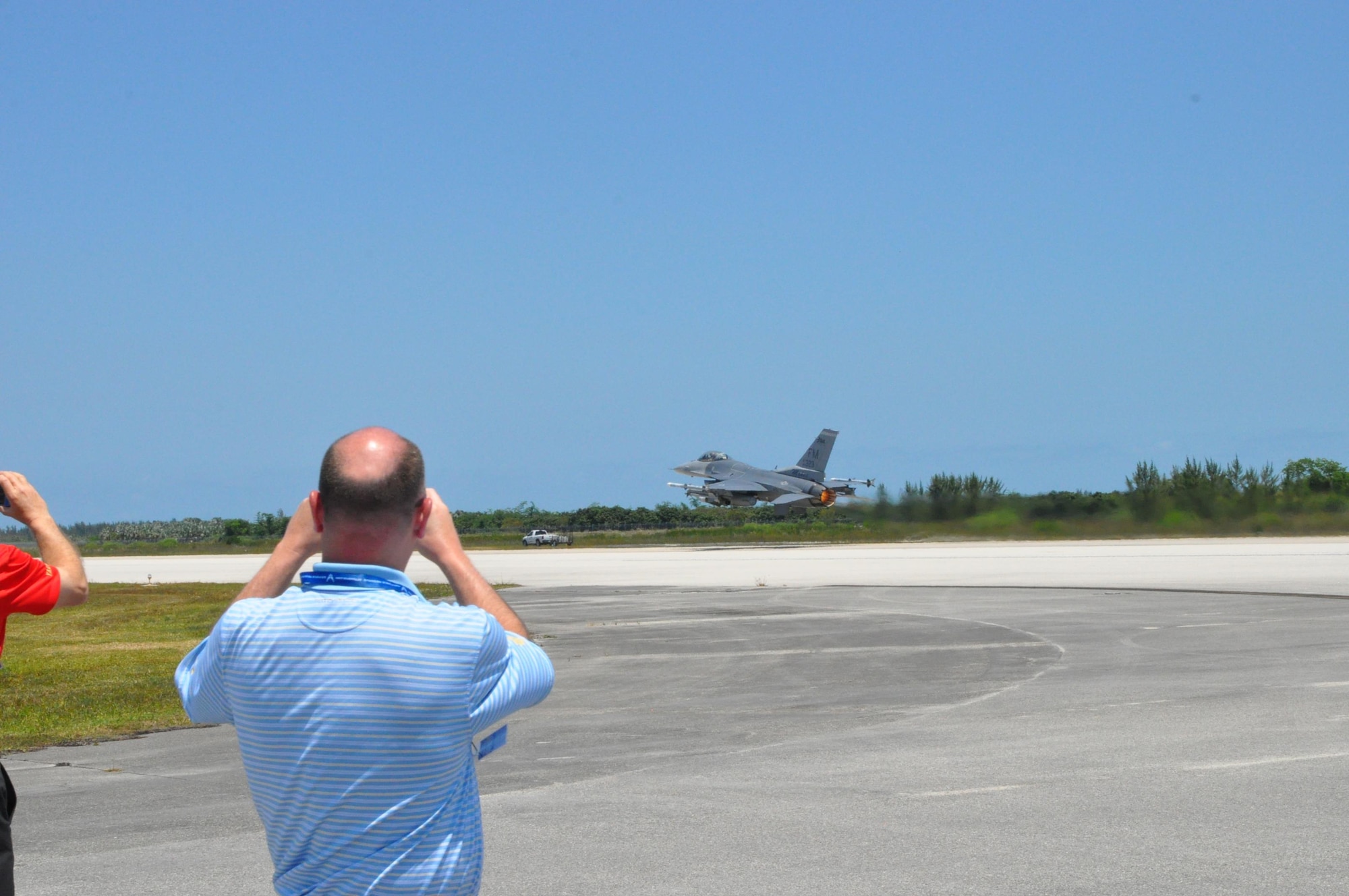 Youngstown, Ohio Mayor John McNally takes a photo of an F-16 Fighting Falcon aircraft, assigned to the 482nd Fighter Wing, as it takes off for a training mission from the runway here, April 28, 2016. The observed fighter launch was part of the itinerary of the 910th Airlift Wing’s 2016 Civic Leader Tour originating from Youngstown Air Reserve Station, Ohio. A group of 35 civic leaders and their military escorts attended the two-day event held April 28-29, 2016, designed to give attendees a better understanding of Air Force Reserve and Joint Operation missions and how they differ from base to base around the country. (U.S. Air Force photo/Master Sgt. Bob Barko Jr.)