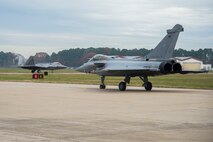 12/9/2015 - A French air force Rafale and U.S Air Force F-22 Raptor prepare to takeoff at Langley Air Force Base, Va., Dec. 7, 2015. The U.S., RAF and French air force are conducting a Trilateral Exercise to share and develop training, tactics and procedures, enabling interoperability among allies. (U.S. Air Force photo by Senior Airman Kayla Newman)