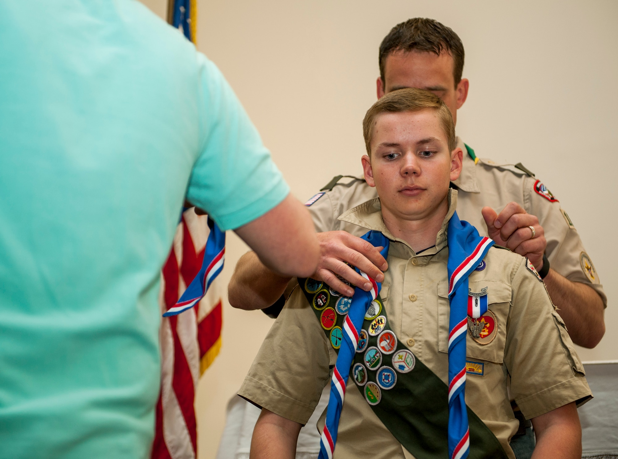 Matthew O’Connor, a Boy Scouts of America Troop 165 member, receives his Eagle Scout neckerchief during a recognition ceremony in the base chapel at Spangdahlem Air Base, Germany, May 18, 2016. The BSA is a values-based youth development organization that provides a program for young people that builds character. (U.S. Air Force photo by Airman 1st Class Timothy Kim/Released)