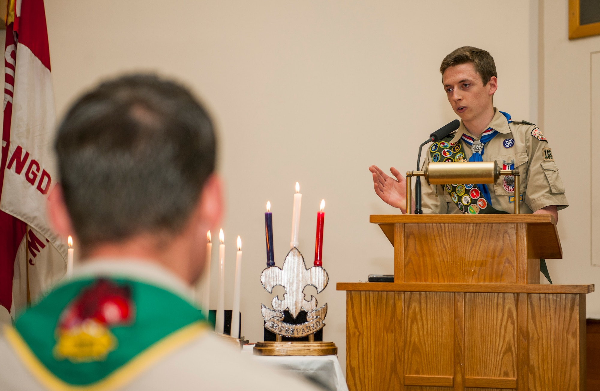 Daniel O’Connor, a Boy Scouts of America Troop 165 Eagle Scout, gives his graduation speech during a recognition ceremony in the base chapel at Spangdahlem Air Base, Germany, May 18, 2016. Scouts must earn a minimum of 21 merit badges including 13 from a required list before becoming an Eagle Scout. (U.S. Air Force photo by Airman 1st Class Timothy Kim/Released)