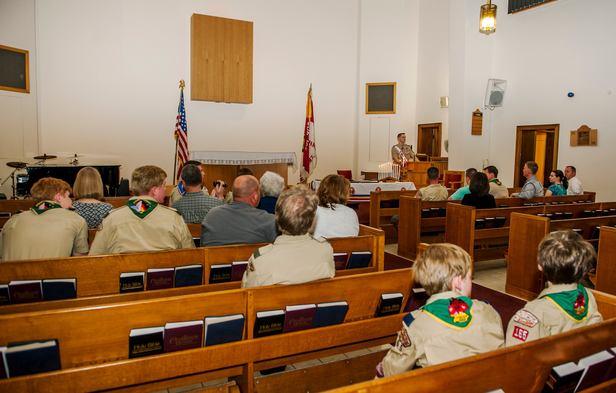 Spangdahlem community members participate in a recognition ceremony in the base chapel at Spangdahlem Air Base, Germany, May 18, 2016. The family and friends of Daniel and Matthew O’Connor, both Boy Scouts of America Troop 165 Eagle Scouts, attended the ceremony in which the scouts received their ranks. (U.S. Air Force photo by Airman 1st Class Timothy Kim/Released)