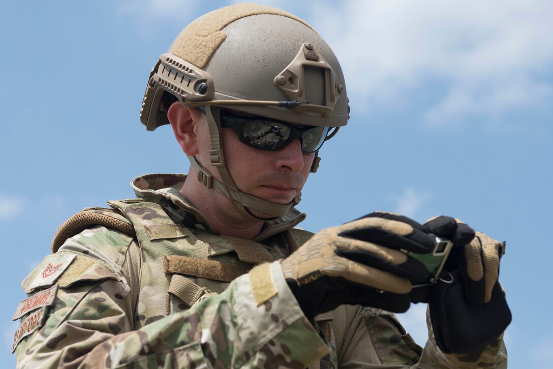U.S. Air Force Tech. Sgt. David Csizmar, 39th Civil Engineer Squadron explosive ordnance disposal craftsman, photographs a simulated improvised explosive device during a training exercise May 17, 2016, at Incirlik Air Base, Turkey. Csizmar documented the area to collect evidence for analysis. (U.S. Air Force photo by Senior Airman John Nieves Camacho/Released)