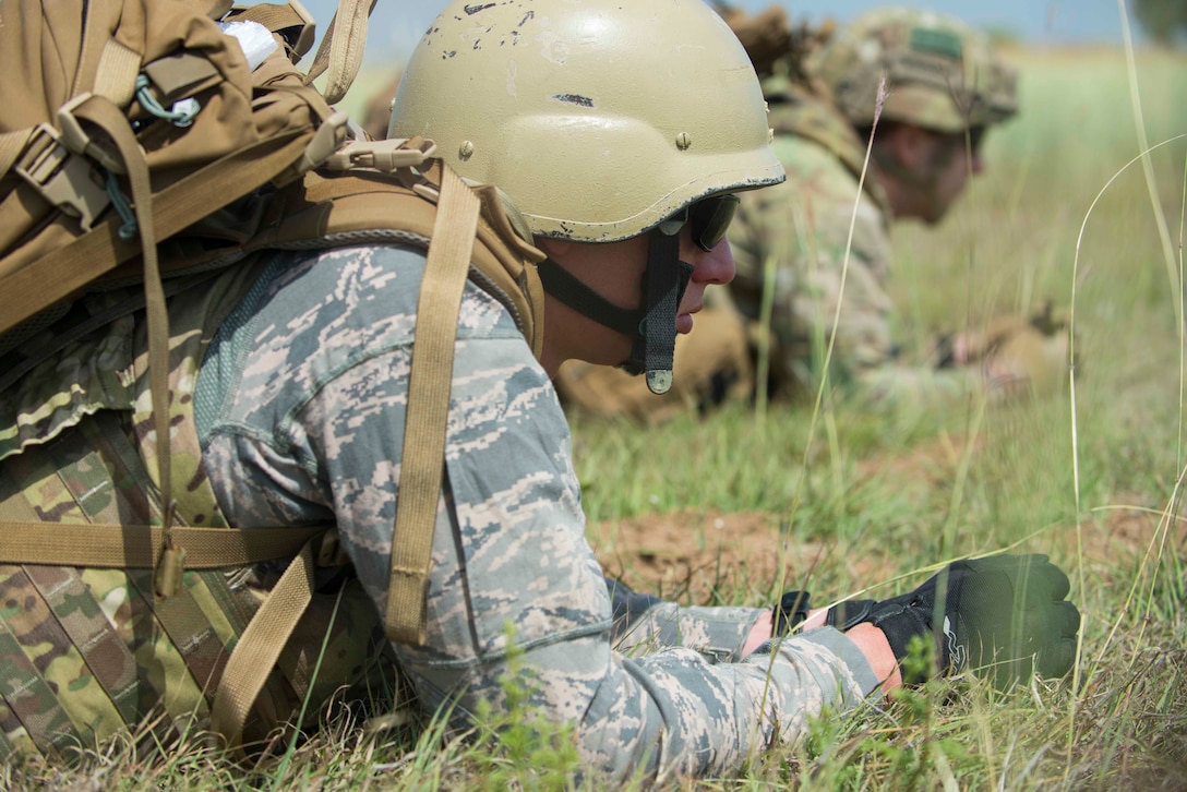 U.S. Air Force Senior Airmen Alexander Reese (left) and Kyle Macey, 39th Civil Engineer Squadron explosive ordnance disposal journeymen, take cover during a training exercise May 17, 2016, at Incirlik Air Base, Turkey. EOD Airmen trained to sharpen their skills for contingency operations overseas. (U.S. Air Force photo by Senior Airman John Nieves Camacho/Released)