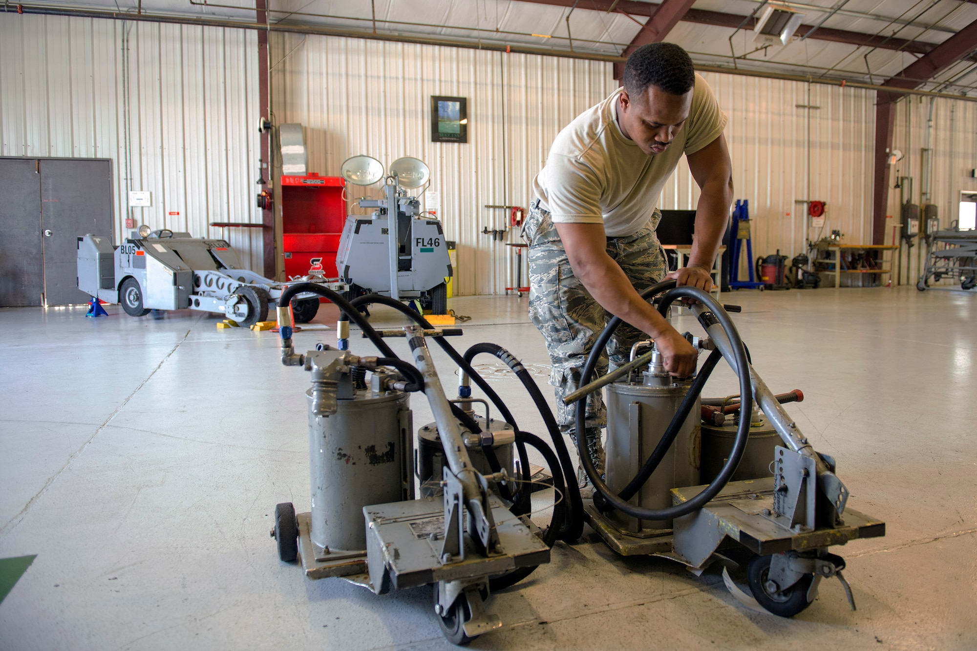 U.S. Air Force Staff Sgt. Byron Smith, 23d Equipment Maintenance Squadron aerospace ground equipment specialist, checks the components of oil servicing carts during an inspection, June 1, 2016, at Moody Air Force Base, Ga. As an AGE specialist, Smith inspects, troubleshoots and conducts hands-on repairs to maintain proper standards for Moody’s aircraft. (U.S. Air Force photo by Airman 1st Class Greg Nash/Released)
