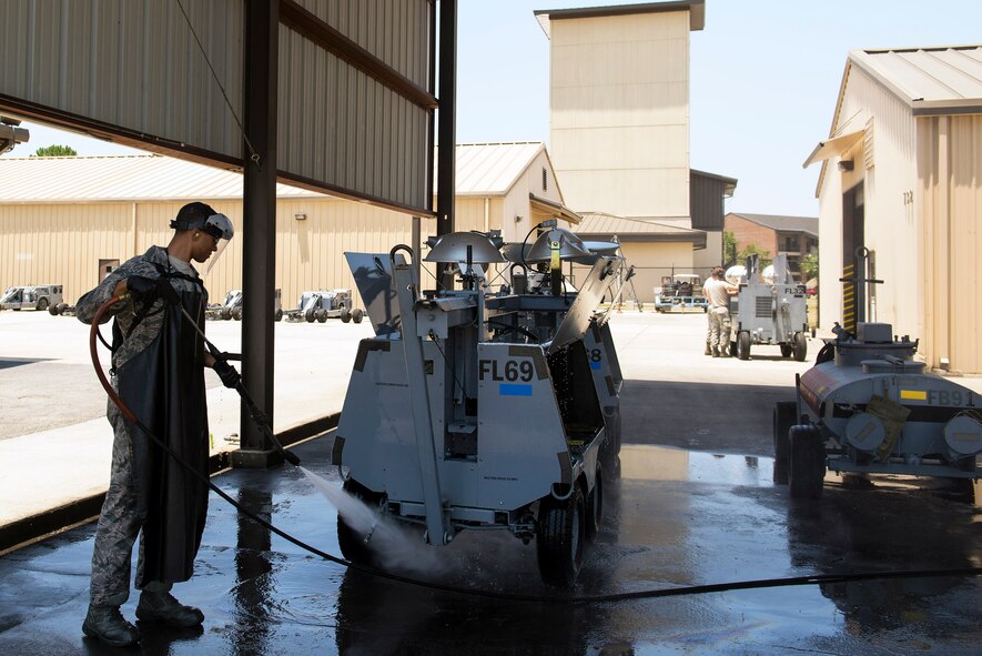 U.S. Air Force Airman 1st Class Marco Lamar, 23d Equipment Maintenance Squadron aerospace ground equipment specialist, hoses down a light cart during a phase two inspection, June 1, 2016, at Moody Air Force Base, Ga. Phase one inspections are functional checks done every six months, while phase two inspections involve a more in-depth functional check by disassembling and reassembling every component of the equipment. (U.S. Air Force photo by Airman 1st Class Greg Nash/Released)