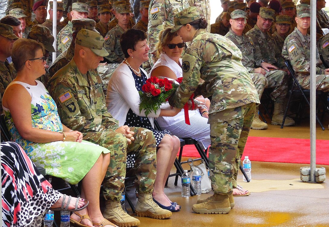 Linda Talley, wife of outgoing Chief of Army Reserve and Commanding General of  U.S. Army Reserve Command, Lt. Gen. Jeffrey W. Talley, is presented with an honorary bouquet of roses by Master Sgt. Sandra M. Cook, USARC Initial Military Training Branch, during the U.S. Army Reserve Command Relinquishment of Command Ceremony held at Marshall Hall, Fort Bragg, N.C., June 1, 2016. The ceremony recognized and honored the contribution the Talley family has given to the U.S. Army Reserve as Lt. Gen. Talley relinquishes his command, prior to the appointment of his replacement. (U.S. Army Reserve photo by Lt. Col. Kristian Sorensen)