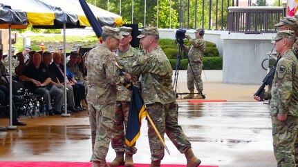 Lt. Gen. Jeffrey W. Talley, Chief of Army Reserve and Commanding General of  U.S. Army Reserve Command, is presented with the USARC flag by Command Sgt. Maj. Jim Wills, USARC Command Sgt. Maj., during the U.S. Army Reserve Command Relinquishment of Command Ceremony held at Marshall Hall, Fort Bragg, N.C., June 1, 2016. The ceremony recognized and honored the contribution the Talley family has given to the U.S. Army Reserve as Lt. Gen. Talley relinquishes his command with the exchange of the command flag. (U.S. Army Reserve photo by Lt. Col. Kristian Sorensen)