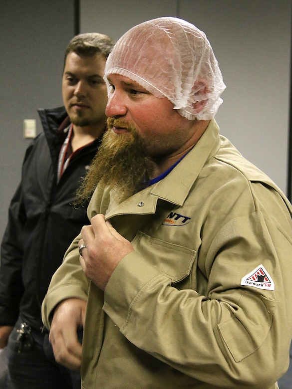 Lake Texoma maintenance worker, Mr. Jason Carr,  dons his personal protective equipment before performing electrical maintenance while being evaluated during the final day of arc flash training. The Tulsa District, U.S. Army Corps of Engineers held arc flash electrical training classes for their maintenance staff May 17-19, 2016, specifially targeted at instructing National Fire Protection Association 70E curriculum. (Photo by Preston Chasteen/Released)
