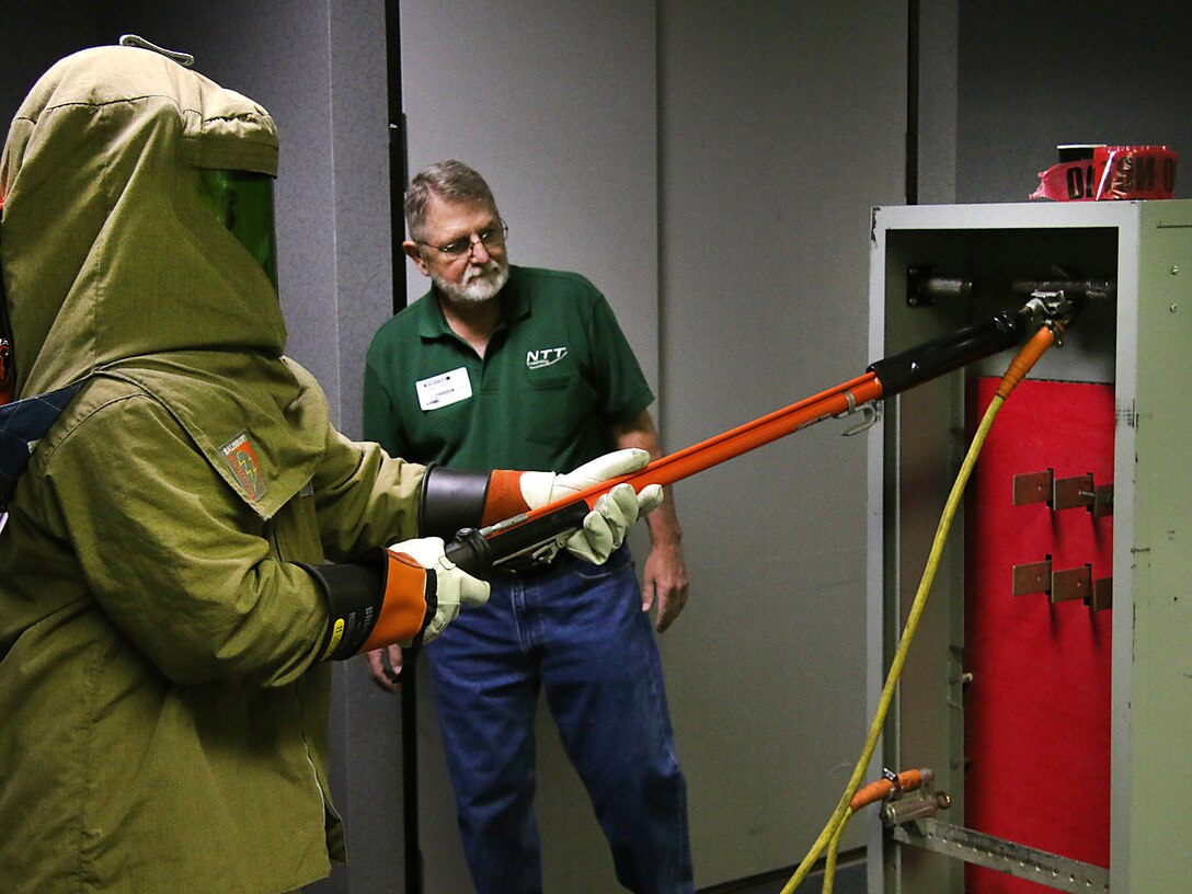 Lake Texoma maintenance worker, Mr. Jason Carr,  performs electrical maintenance while being evaluated during the final day of arc flash training. The Tulsa District, U.S. Army Corps of Engineers held arc flash electrical training classes for their maintenance staff May 17-19, 2016, specifially targeted at instructing National Fire Protection Association 70E curriculum. (Photo by Preston Chasteen/Released)