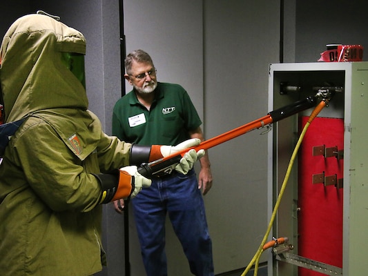 Lake Texoma maintenance worker, Mr. Jason Carr,  performs electrical maintenance while being evaluated during the final day of arc flash training. The Tulsa District, U.S. Army Corps of Engineers held arc flash electrical training classes for their maintenance staff May 17-19, 2016, specifially targeted at instructing National Fire Protection Association 70E curriculum. (Photo by Preston Chasteen/Released)