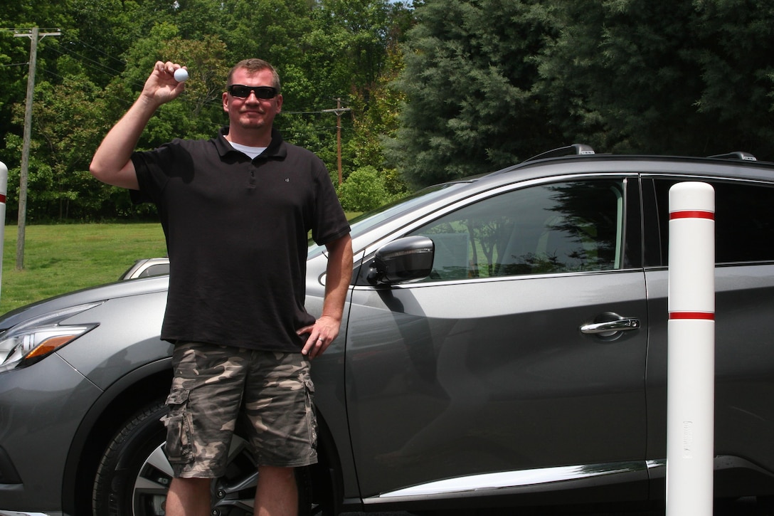 Eric Farrell won a 2015 Nissan Murano for making a hole-in-one at the Medal of Honor Golf Course aboard Marine Corps Base Quantico May 20.