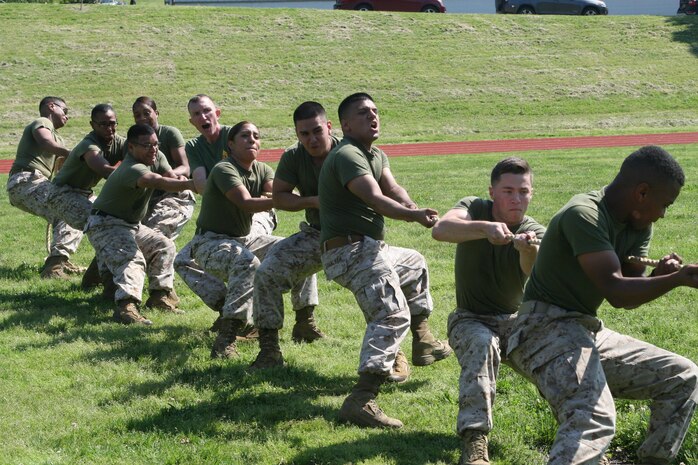 Marines in Service Company compete in tug-of-war at a safety stand-down and field meet sponsored by Headquarters and Service Battalion and CSACC May 25.