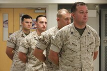 NAVAL SUPPORT FACILITY INDIAN HEAD, Md. – Corporals with Chemical Biological Incident Response Force (CBIRF), U.S. Marine Corps Forces Command (MARFORCOM), graduate from command sponsored Corporals Leadership Course during a ceremony at Naval Support Facility Indian Head, Md., May 27, 2016. The night before, the Marines tested their refined customs and courtesies during a Mess Night with Gunnery Sgt. Amber T. Chavarria, faculty advisor at Staff Noncommissioned Officer Academy, Marine Corps Base Quantico, Va., as the event’s guest of honor. The noncommissioned officers completed the 3 week course curriculum that included sword and guidon manual, land navigation, Marine Corps promotion system for sergeants and below and other small unit leader skills and traits. (Official USMC Photos by Sgt. Santiago G. Colon Jr. and Sgt. Jonathan S. Herrera)