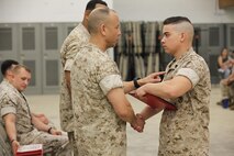 NAVAL SUPPORT FACILITY INDIAN HEAD, Md. – Corporals with Chemical Biological Incident Response Force (CBIRF), U.S. Marine Corps Forces Command (MARFORCOM), graduate from command sponsored Corporals Leadership Course during a ceremony at Naval Support Facility Indian Head, Md., May 27, 2016. The night before, the Marines tested their refined customs and courtesies during a Mess Night with Gunnery Sgt. Amber T. Chavarria, faculty advisor at Staff Noncommissioned Officer Academy, Marine Corps Base Quantico, Va., as the event’s guest of honor. The noncommissioned officers completed the 3 week course curriculum that included sword and guidon manual, land navigation, Marine Corps promotion system for sergeants and below and other small unit leader skills and traits. (Official USMC Photos by Sgt. Santiago G. Colon Jr. and Sgt. Jonathan S. Herrera)