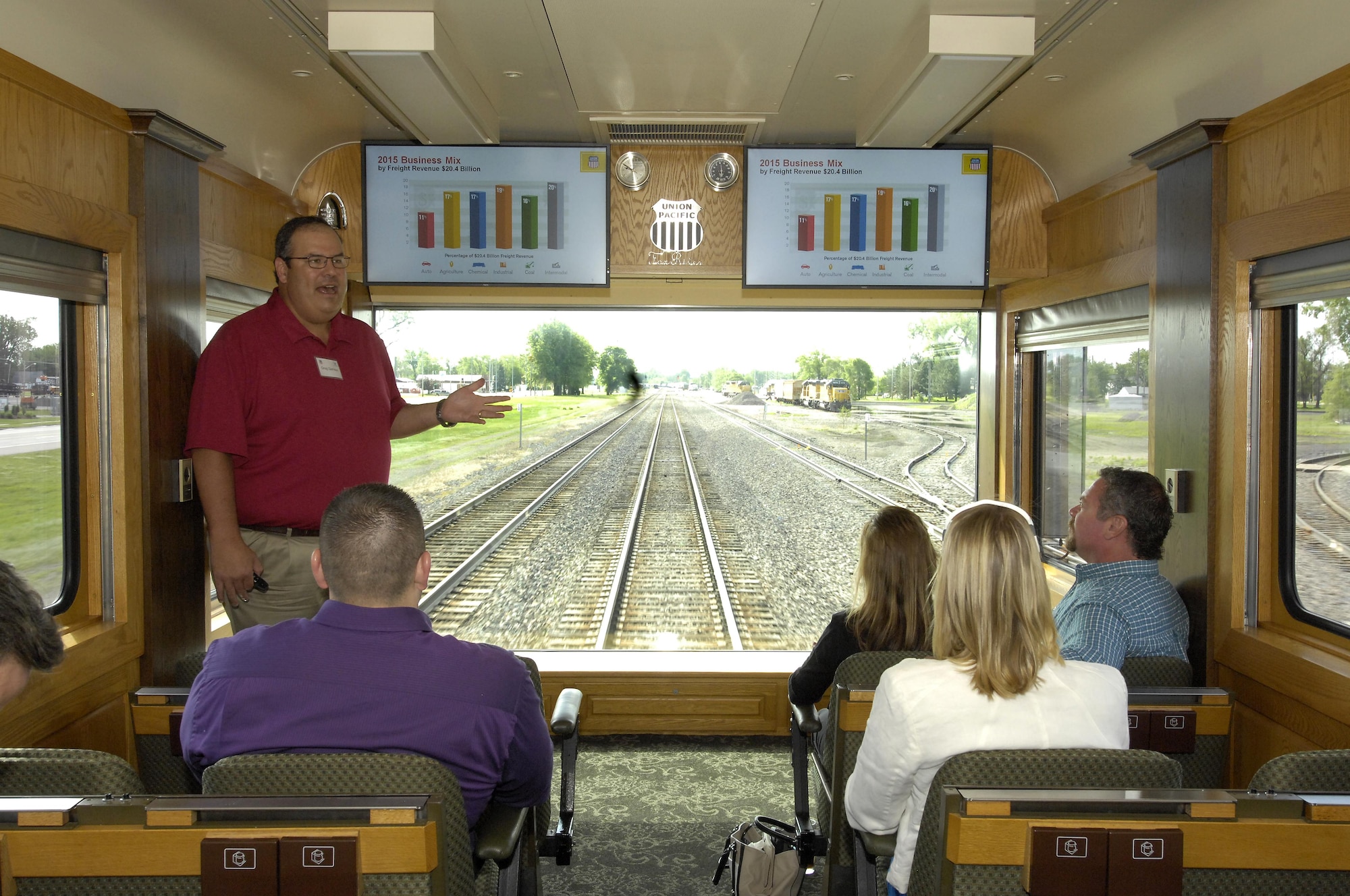 Greg Garrison, Union Pacific regional vice president of transportation for the northern region, gives a briefing on the “Fox River” inspection car to members of Team Offutt May 27. They participated in a day-long train ride to Grand Island, Neb. where they learned about UP and the company's mission. (U.S. Air Force photo by Delanie Stafford)