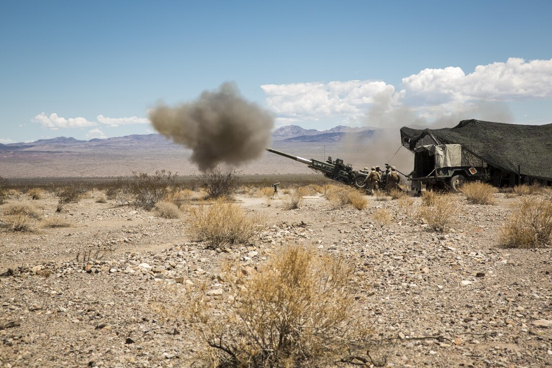 Marines with 3rd Battalion, 10th Marine Regiment, 2nd Marine Division, fire a 155mm M777A2 Light-weight Towed Howitzer in the Black Top Training Area aboard Marine Corps Air Ground Combat Center Twentynine Palms, Calif., May 18, 2016. Various units from 2nd Marine Division participated in Integrated Training Exercise 3-16 in preparation for their deployment with Special Purpose Marine Air Ground Task Force-Crisis Response-Africa. (Official Marine Corps photo by Lance Cpl. Levi Schultz/Released)