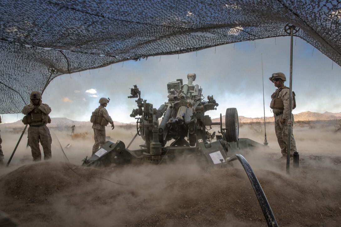 Marines with 3rd Battalion, 10th Marine Regiment, 2nd Marine Division, fire a 155mm M777A2 Light-weight Towed Howitzer in the Black Top Training Area aboard Marine Corps Air Ground Combat Center Twentynine Palms, Calif., May 18, 2016. Various units from 2nd Marine Division participated in Integrated Training Exercise 3-16 in preparation for their deployment with Special Purpose Marine Air Ground Task Force-Crisis Response-Africa. (Official Marine Corps photo by Lance Cpl. Levi Schultz/Released)