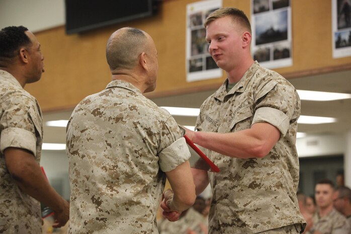 NAVAL SUPPORT FACILITY INDIAN HEAD, Md. – Corporals with Chemical Biological Incident Response Force (CBIRF), U.S. Marine Corps Forces Command (MARFORCOM), graduate from command sponsored Corporals Leadership Course during a ceremony at Naval Support Facility Indian Head, Md., May 27, 2016. The night before, the Marines tested their refined customs and courtesies during a Mess Night with Gunnery Sgt. Amber T. Chavarria, faculty advisor at Staff Noncommissioned Officer Academy, Marine Corps Base Quantico, Va., as the event’s guest of honor. The noncommissioned officers completed the 3 week course curriculum that included sword and guidon manual, land navigation, Marine Corps promotion system for sergeants and below and other small unit leader skills and traits. (Official USMC Photos by Sgt. Santiago G. Colon Jr. and Sgt. Jonathan S. Herrera)