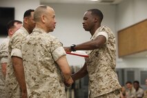 NAVAL SUPPORT FACILITY INDIAN HEAD, Md. – Corporals with Chemical Biological Incident Response Force (CBIRF), U.S. Marine Corps Forces Command (MARFORCOM), graduate from command sponsored Corporals Leadership Course during a ceremony at Naval Support Facility Indian Head, Md., May 27, 2016. The night before, the Marines tested their refined customs and courtesies during a Mess Night with Gunnery Sgt. Amber T. Chavarria, faculty advisor at Staff Noncommissioned Officer Academy, Marine Corps Base Quantico, Va., as the event’s guest of honor. The noncommissioned officers completed the 3 week course curriculum that included sword and guidon manual, land navigation, Marine Corps promotion system for sergeants and below and other small unit leader skills and traits. (Official USMC Photos by Sgt. Santiago G. Colon Jr. and Sgt. Jonathan S. Herrera)