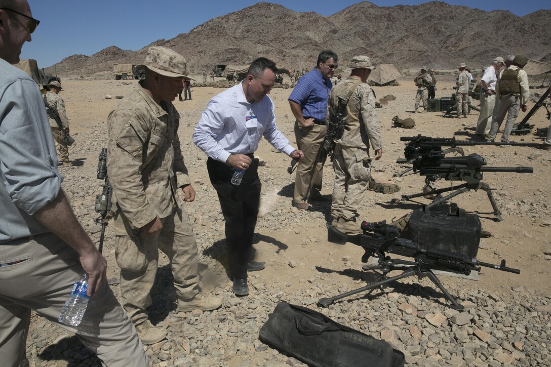 Marines with 3rd Battalion, 4th Marines, 7th Regiment teach representatives of Business Executives for National Security about various weapons systems utilized by the Marine Corps at Range 410 aboard Marine Corps Air Ground Combat Center, Twentynine Palms Calif., May 19, 2016. (Official Marine Corp photo by Cpl. Thomas Mudd/Released)