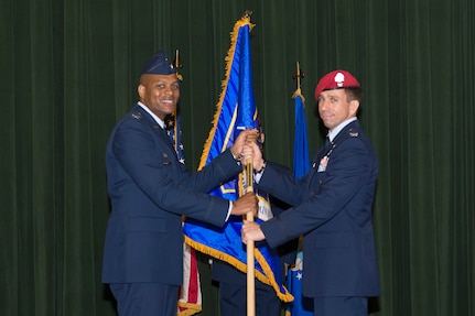 Col. Roy Collins, commander of the 37th Training Wing, passes the Battlefield Airman Training Group guidon to Col. Ronald Stenger, the inaugural commander of the BA TG, during the BA TG activation ceremony June 2, 2016, at Joint Base San Antonio-Lackland, Texas. The BA TG encompasses five subordinate squadrons, whose members will train the Air Force's conventional and special operations ground forces, including combat controllers, pararescuemen, special operations weathermen and tactical air control party Airmen. The vision of the group is to become the recognized leader among the special operations forces selection and training community while driving human performance innovation for tactical athletes. 