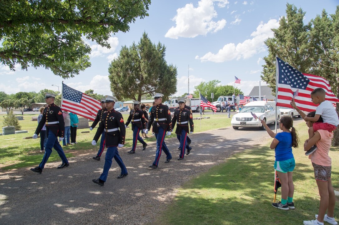 Marines with Motor Transportation Company, Combat Logistics Battalion 453, Combat Logistics Regiment 4, 4th Marine Logistics Group, Marine Forces Reserve, escort the hearse carrying Pfc. Elmer L. Mathies during a memorial service in Hereford, Texas, May 28, 2016. Mathies is a World War II veteran who was killed in action during the Battle of Tarawa in 1943. His remains were found and recovered on the island in 2015 by the nonprofit organization History Flight, which is dedicated to preserving and honoring World War II, Vietnam and Gulf War combat veterans.  (U.S. Marine Corps photo by Staff Sgt. Ryan Ramirez/ Released)