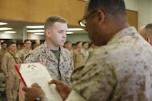 NAVAL SUPPORT FACILITY INDIAN HEAD, MD -- Warrant Officer Daniel Pare, an explosive ordnance disposal officer, with Chemical Biological Incident Response Force (CBIRF), receives the Bronze Star Medal with Combat Distinguishing Device for heroic service in connection with combat operations against the enemy in support of Operation Enduring Freedom while serving as an explosive ordnance disposal team lead, 2nd Marine Logistics Group (Forward), II Marine Expeditionary Force (Forward), in Watan Kalay, Gereshk Valley, Afghan., from Apr. 9, 2011 to Oct. 24, 2011.

Pare, a native of Bristol, Mass., disposed of more than 47,000 pounds of explosive material including 30 improvised explosive devices and 11 enemy weapons caches during this time period.

On July 15, 2011, he rendered aid to a seriously wounded soldier while under heavy enemy fire, and after leaving his covered position, he maneuvered to the wounded soldier and administered critical medical aid until the wounded soldier was evacuated.

While further assisting in the defense of his unit’s position, Pare located a spotter for enemy mortars and directly engaged him with a M2CG recoilless rifle system, ultimately succeeding in neutralizing the enemy observer and decimating the enemy’s will to persist. (Official USMC Photos by Sgt. Santiago G. Colon Jr./Released) 
