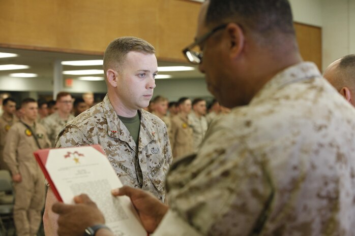 NAVAL SUPPORT FACILITY INDIAN HEAD, MD -- Warrant Officer Daniel Pare, an explosive ordnance disposal officer, with Chemical Biological Incident Response Force (CBIRF), receives the Bronze Star Medal with Combat Distinguishing Device for heroic service in connection with combat operations against the enemy in support of Operation Enduring Freedom while serving as an explosive ordnance disposal team lead, 2nd Marine Logistics Group (Forward), II Marine Expeditionary Force (Forward), in Watan Kalay, Gereshk Valley, Afghan., from Apr. 9, 2011 to Oct. 24, 2011.

Pare, a native of Bristol, Mass., disposed of more than 47,000 pounds of explosive material including 30 improvised explosive devices and 11 enemy weapons caches during this time period.

On July 15, 2011, he rendered aid to a seriously wounded soldier while under heavy enemy fire, and after leaving his covered position, he maneuvered to the wounded soldier and administered critical medical aid until the wounded soldier was evacuated.

While further assisting in the defense of his unit’s position, Pare located a spotter for enemy mortars and directly engaged him with a M2CG recoilless rifle system, ultimately succeeding in neutralizing the enemy observer and decimating the enemy’s will to persist. (Official USMC Photos by Sgt. Santiago G. Colon Jr./Released) 
