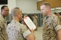 NAVAL SUPPORT FACILITY INDIAN HEAD, MD -- Warrant Officer Daniel Pare, an explosive ordnance disposal officer, with Chemical Biological Incident Response Force (CBIRF), receives the Bronze Star Medal with Combat Distinguishing Device for heroic service in connection with combat operations against the enemy in support of Operation Enduring Freedom while serving as an explosive ordnance disposal team lead, 2nd Marine Logistics Group (Forward), II Marine Expeditionary Force (Forward), in Watan Kalay, Gereshk Valley, Afghan., from Apr. 9, 2011 to Oct. 24, 2011.

Pare, a native of Bristol, Mass., disposed of more than 47,000 pounds of explosive material including 30 improvised explosive devices and 11 enemy weapons caches during this time period.

On July 15, 2011, he rendered aid to a seriously wounded soldier while under heavy enemy fire, and after leaving his covered position, he maneuvered to the wounded soldier and administered critical medical aid until the wounded soldier was evacuated.

While further assisting in the defense of his unit’s position, Pare located a spotter for enemy mortars and directly engaged him with a M2CG recoilless rifle system, ultimately succeeding in neutralizing the enemy observer and decimating the enemy’s will to persist. (Official USMC Photos by Sgt. Santiago G. Colon Jr./Released) 
