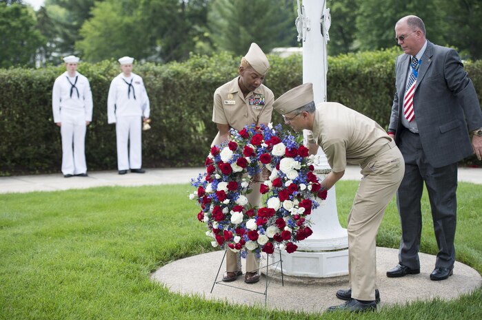 From left: Manpower, Personnel, Training and Education Fleet Master Chief (AW/SW) April D. Beldo, Naval Surface Warfare Center Carderock Division (NSWCCD)Commanding Officer Capt. Rich Blank and NSWCCD Veterans Employee Resource Group Coordinator Kevin Mook place a wreath at the base of the flag pole during the Memorial Day wreath-laying ceremony in West Bethesda, Md., May 31, 2016. (U.S. Navy photo by Devin Pisner/Released)