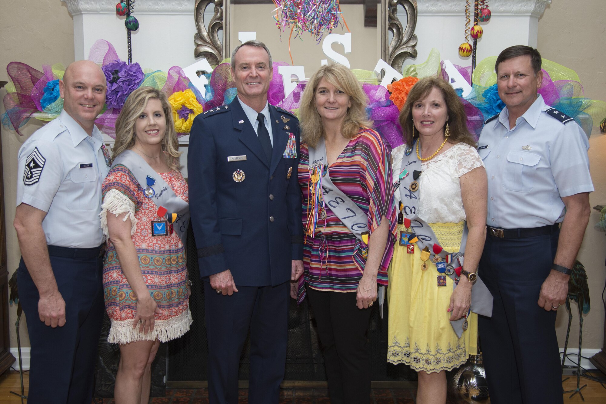 From left: From a 2016 Fiesta event with Lynne and Maj. Gen. Leonard Patrick, at far right of photo, are Chief Master Sgt. David Staton, AETC command chief and his wife, Kimberly, Lt. Gen. Darryl Roberson, AETC commander, and his wife, Cheryl. (U.S. Air Force photo by Senior Airman Stormy Archer)