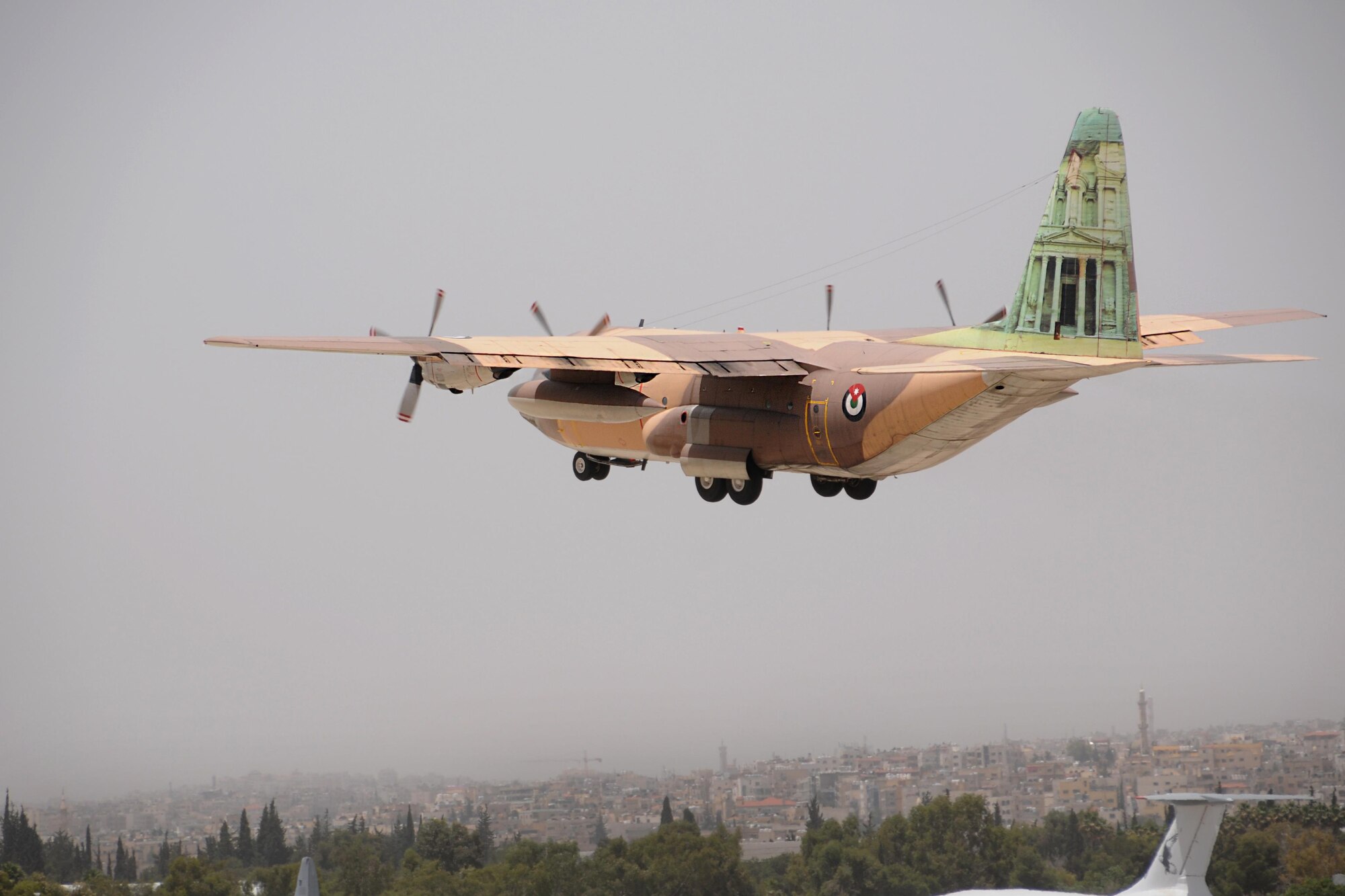 A Royal Jordanian Air Force C-130 takes off in Amman, Jordan, as part of familiarization flight with crews from the 94th Airlift Wing, Dobbins Air Reserve Base, Ga., May 15, 2016. The flight was the initial C-130 flight in Exercise Eager Lion, a bilaterial exercise including U.S. and Jordanian military forces, held May 15-24. (U.S. Air Force photo/Staff Sgt. Alan Abernethy)