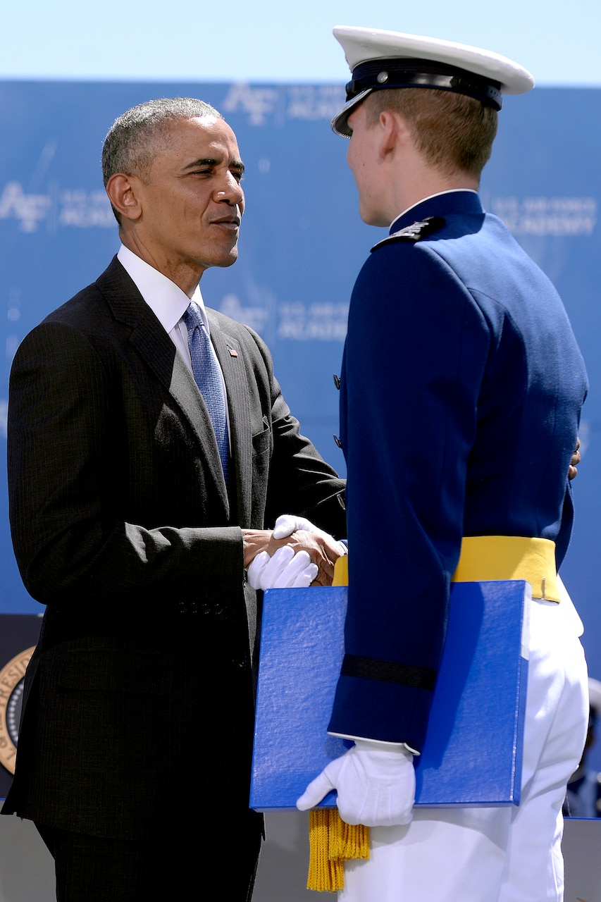 President Barack Obama congratulates Air Force Cadet 1st Class Jeffrey Herrala, the Class of 2016's top graduate, during the commencement ceremony at the U.S. Air Force Academy in Colorado Springs, Colo., June 2, 2016. Air Force photo by Bill Evans