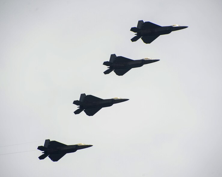 A four-ship formation of F-22 Raptors from the 95th Fighter Squadron flies over Tyndall Air Force Base, May 19, 2016. The 95th FS, proudly nicknamed the "Boneheads," was activated in early 1942, and flew the original twin-tailed fighter, the P-38 Lightning, taking part in the Allied invasions of North Africa and Italy in World War II. The squadron performed aerial combat and support, winning two Distinguished Unit Citations during attacks on the Italian peninsula. (U.S. Air Force photo by Airman 1st Class Cody R. Miller/Released)