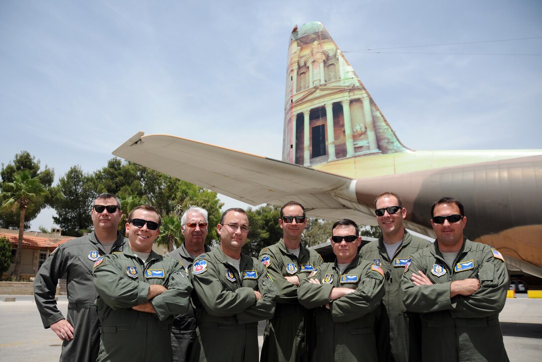 Members of the 700th Airlift Squadron stand in front of a Royal Jordanian Air Force C-130 before taking a flight in it during exercise Eager Lion 2016, May 15, 2016. Eager Lion is a bilateral exercise including U.S. and Jordanian military forces, held May 15-24. (U.S. Air Force photo/Staff Sgt. Alan Abernethy)